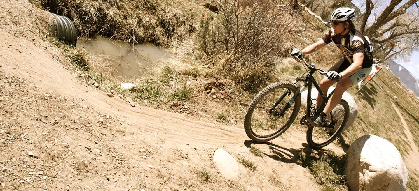 Bo Pihl enjoying a short descent on his single speed mountain bike. by Karen Jarchow